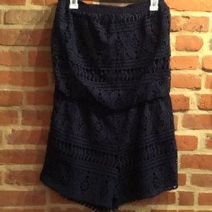 Laffaire lace strapless romper with front pockets.